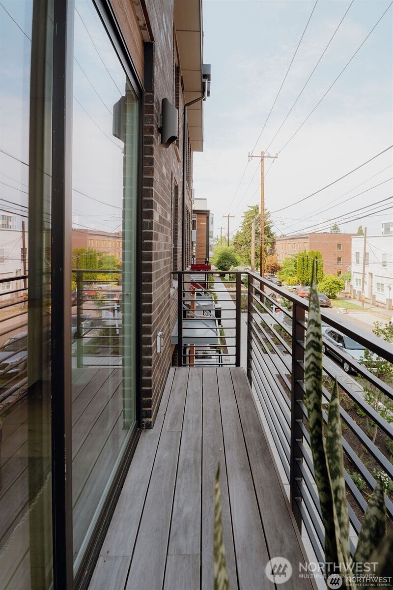 1709 20th Avenue, Unit A Seattle, WA 98122 - Photo 9 of 20 a view of a balcony with wooden floor