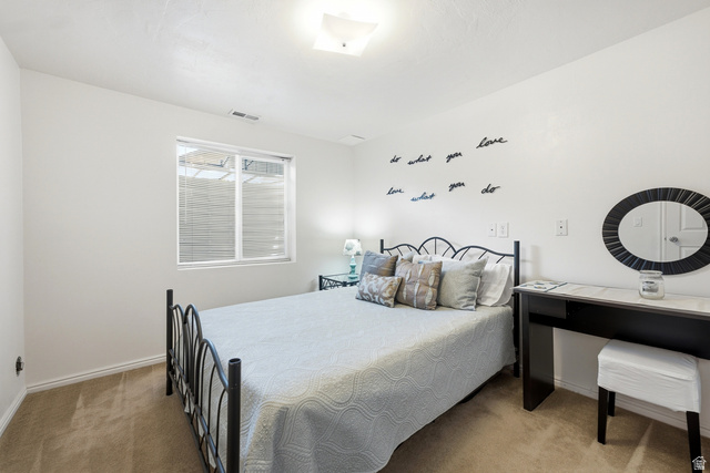 5196 Rodeo Circle Oakley, UT 84055 - Photo 36 of 57 Bedroom featuring light-colored walls and carpet flooring