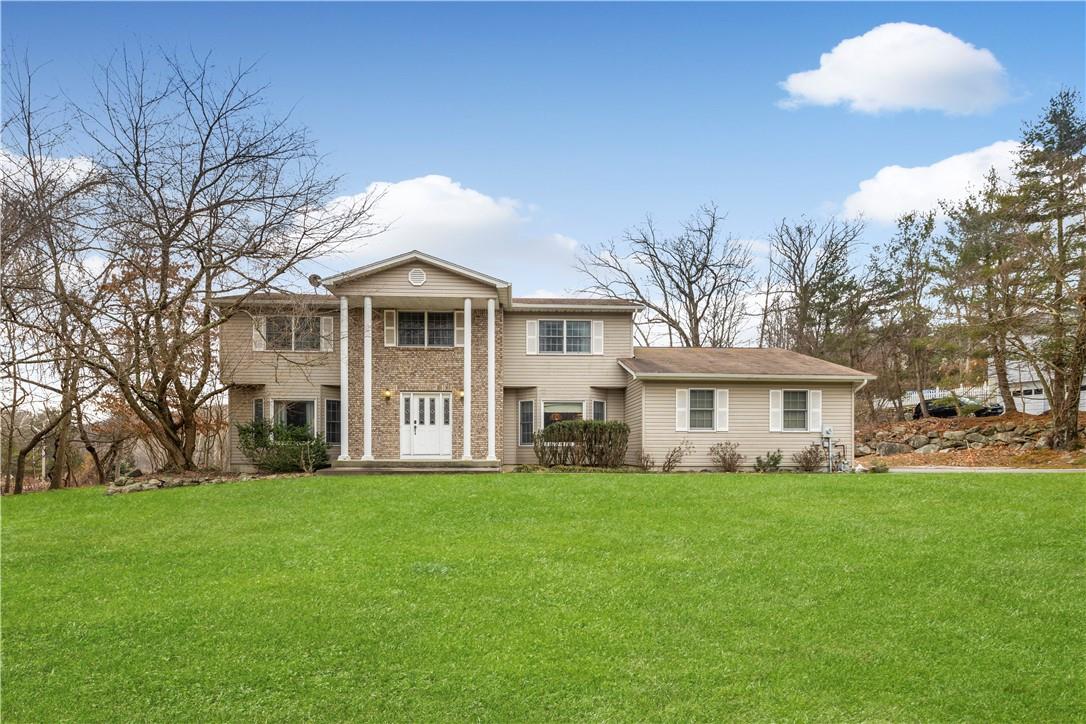 2 Colonel Conklin Drive Stony Point, NY 10980 - Photo 1 of 1 a front view of house with yard and green space