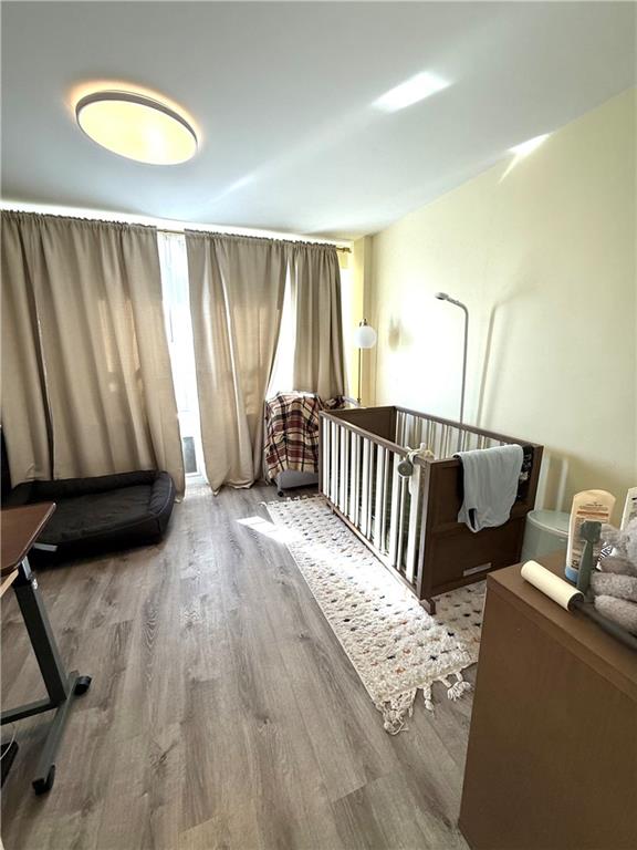 501 Surf Avenue, Unit 23M Brooklyn, NY 11224 - Photo 11 of 24 a view of a bedroom with furniture and staircase