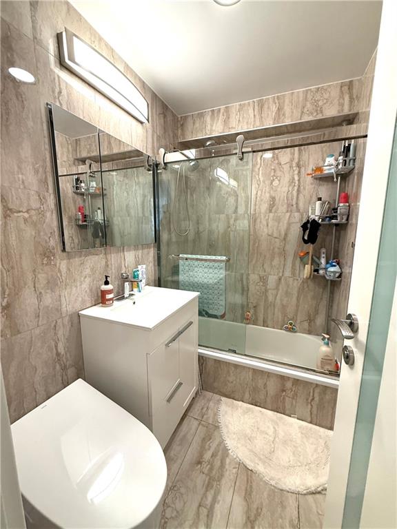 501 Surf Avenue, Unit 23M Brooklyn, NY 11224 - Photo 14 of 24 a bathroom with a sink toilet and shower