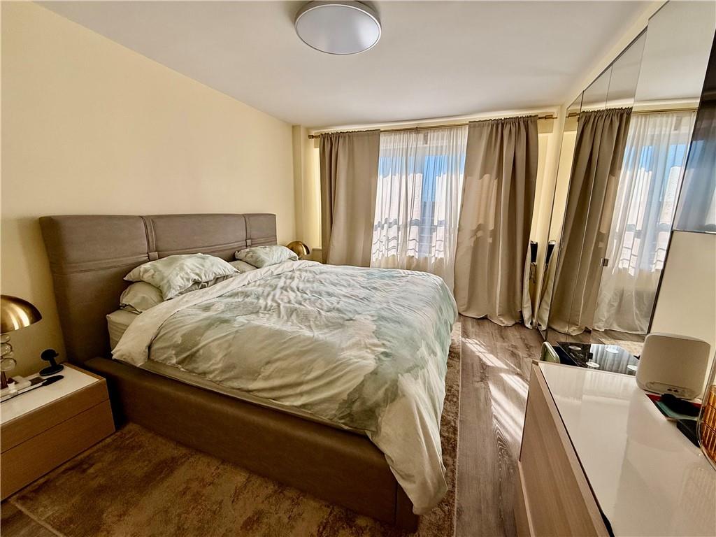 501 Surf Avenue, Unit 23M Brooklyn, NY 11224 - Photo 17 of 24 a bed sitting in a bedroom next to a window