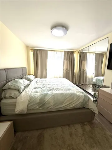 a view of balcony with wooden floor