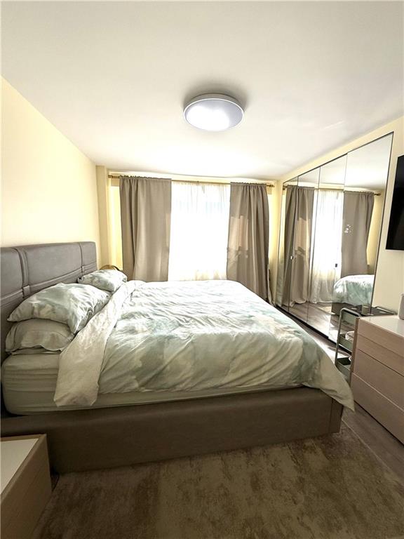 501 Surf Avenue, Unit 23M Brooklyn, NY 11224 - Photo 18 of 24 a bedroom with a bed and window