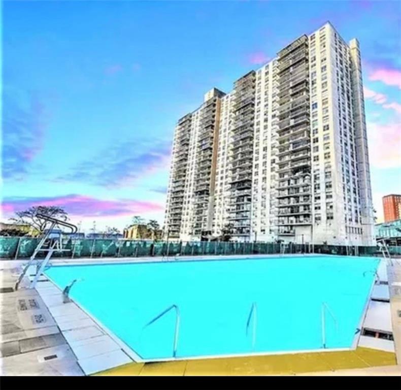 501 Surf Avenue, Unit 23M Brooklyn, NY 11224 - Photo 20 of 24 a view of a large building with a yard