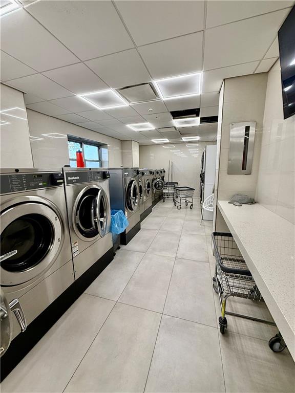 501 Surf Avenue, Unit 23M Brooklyn, NY 11224 - Photo 22 of 24 a view of a storage & utility room with washer and dryer
