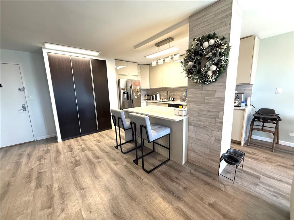 501 Surf Avenue, Unit 23M Brooklyn, NY 11224 - Photo 3 of 24 a view of a workspace with furniture and a livingroom