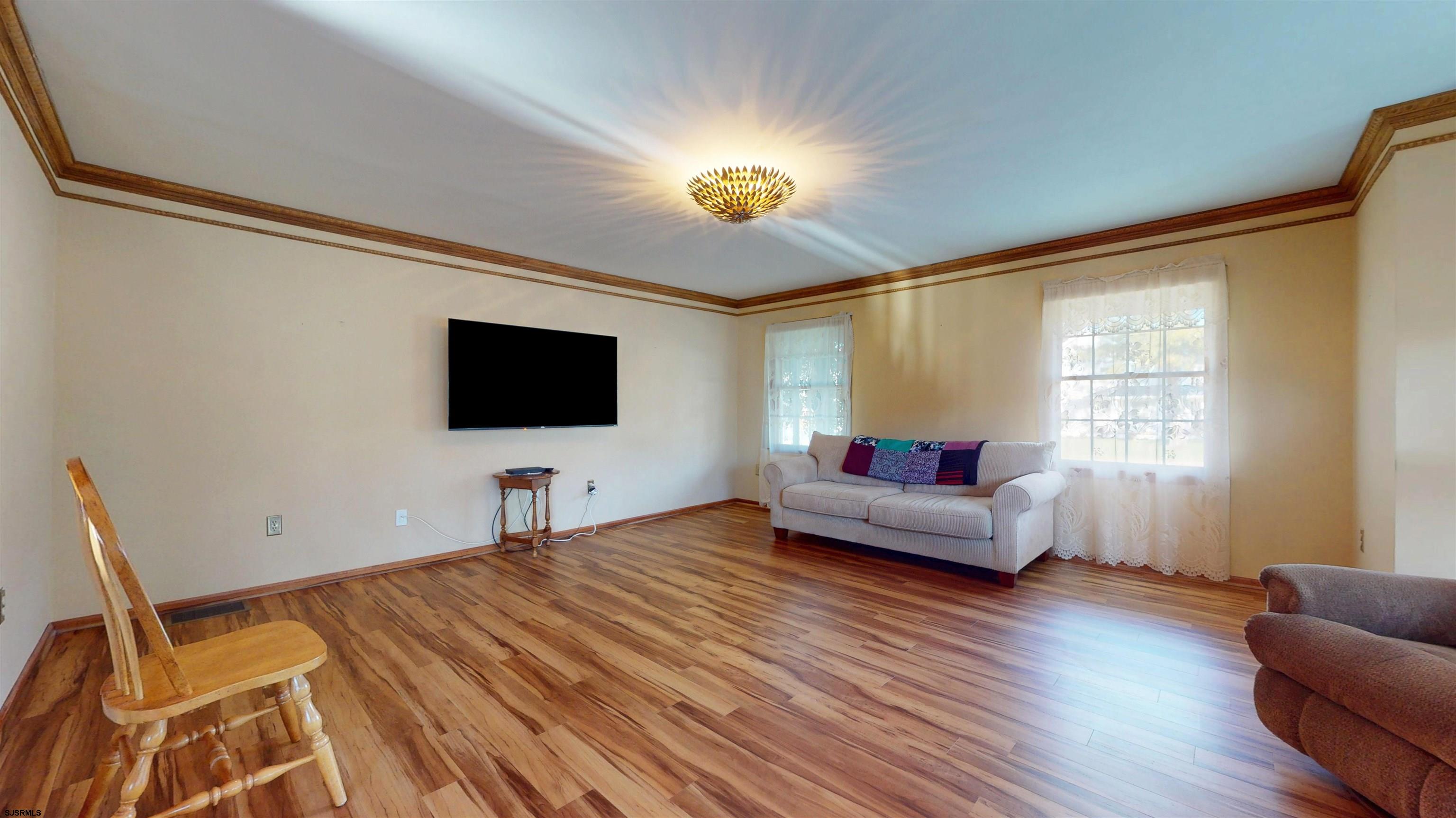 46 Victoria Lane Ocean View, NJ 08230 - Photo 15 of 66 a living room with furniture and a flat screen tv