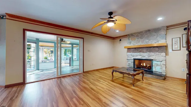 a view of a dining room with furniture wooden floor and chandelier