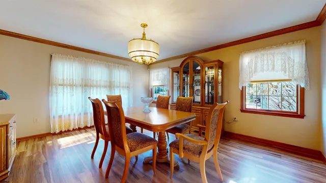 a bedroom with furniture a fireplace and a window