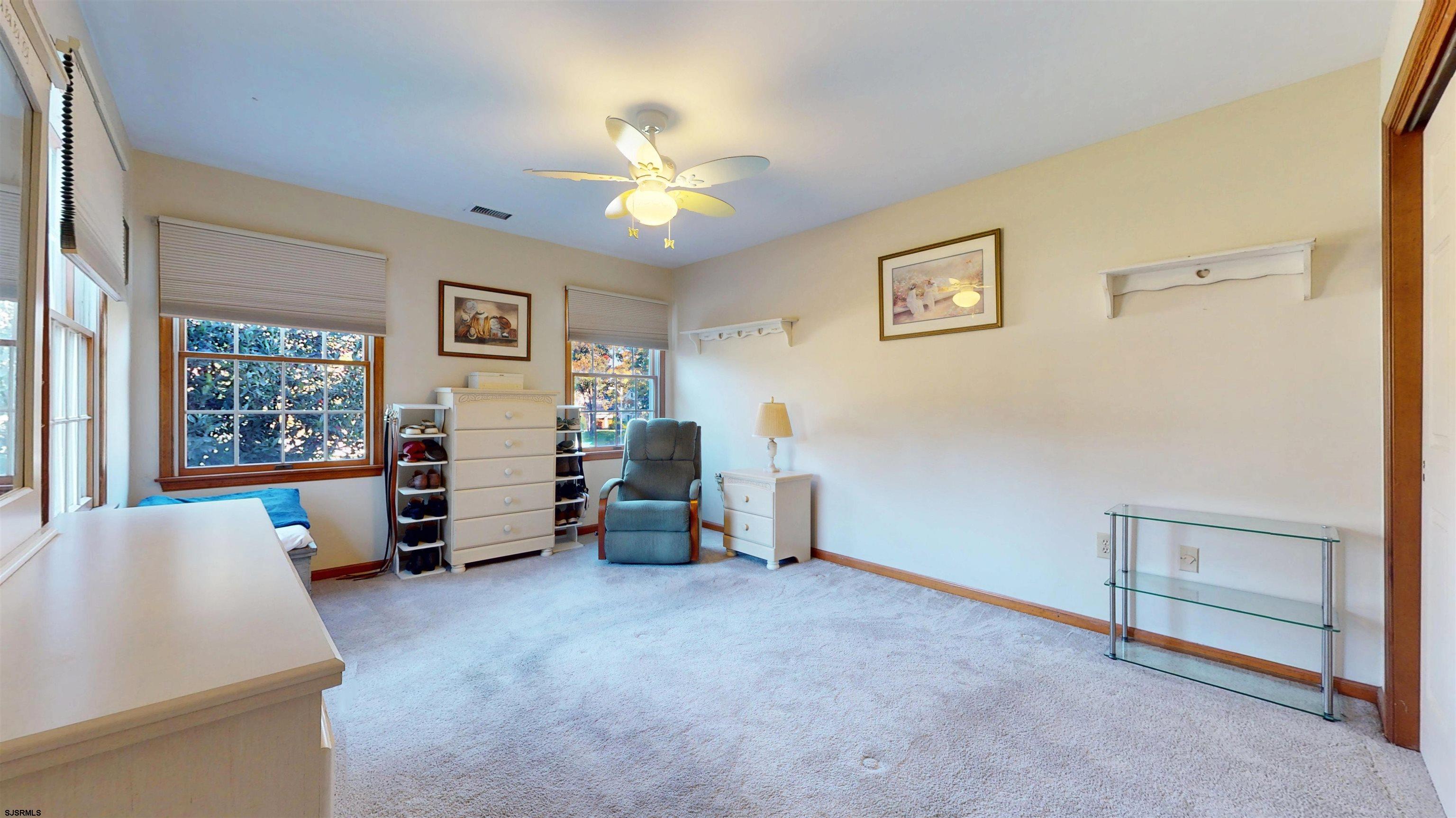 46 Victoria Lane Ocean View, NJ 08230 - Photo 31 of 66 a view of a livingroom with furniture and a ceiling fan