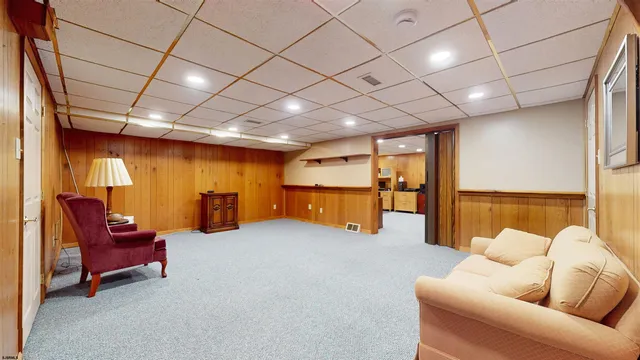 a view of an entryway with wooden floor and stairs
