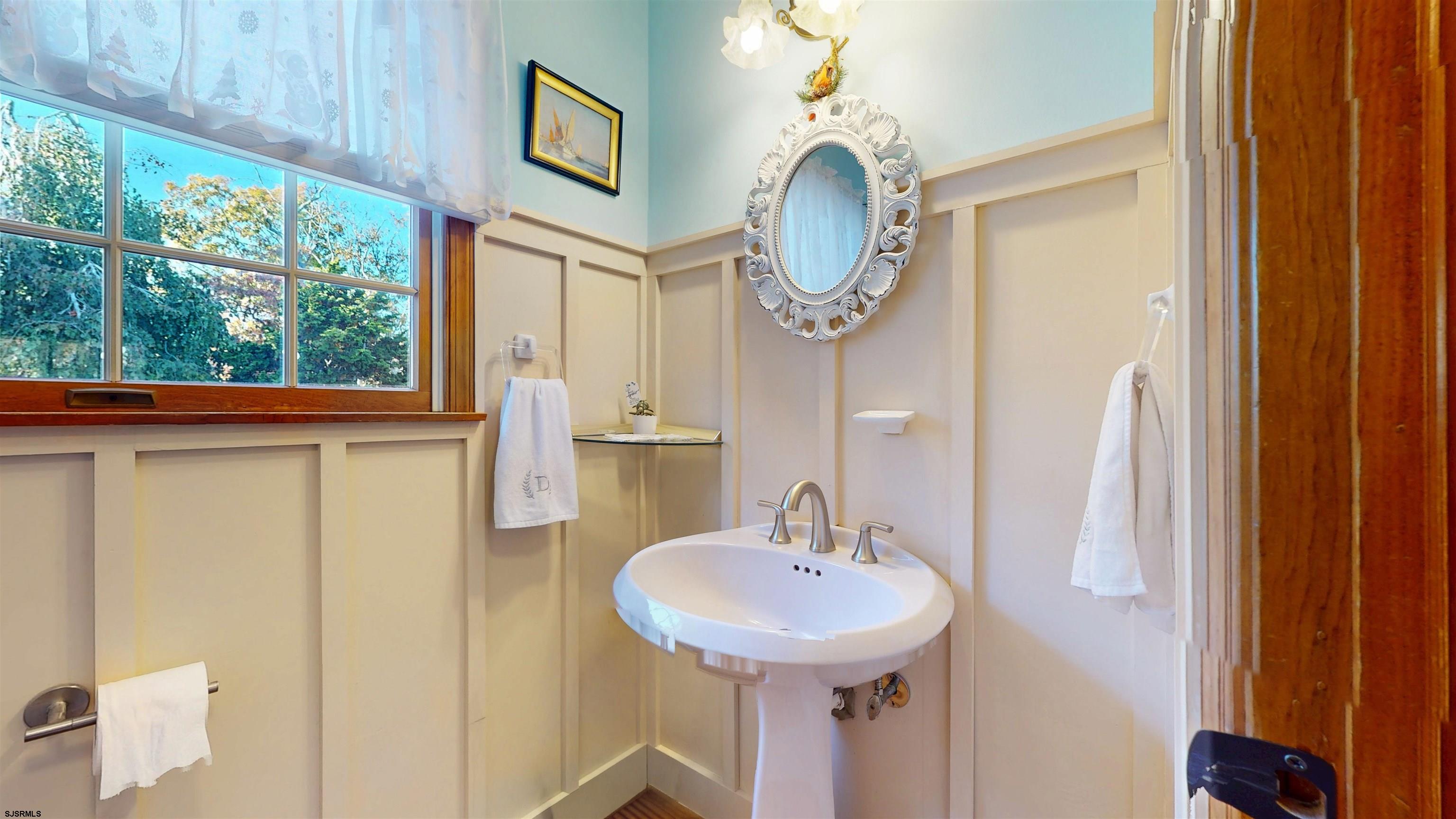 46 Victoria Lane Ocean View, NJ 08230 - Photo 42 of 66 a bathroom with a sink and a mirror