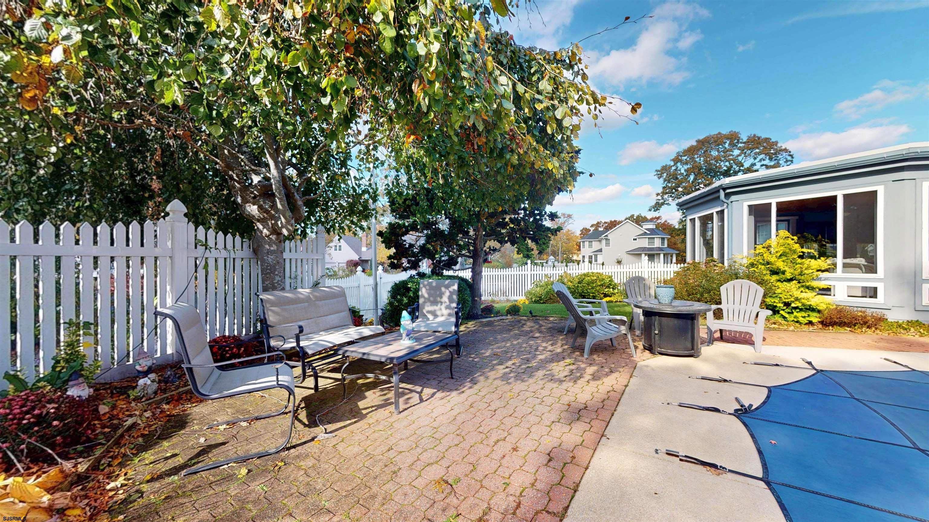 46 Victoria Lane Ocean View, NJ 08230 - Photo 48 of 66 a view of a backyard with sitting area and furniture