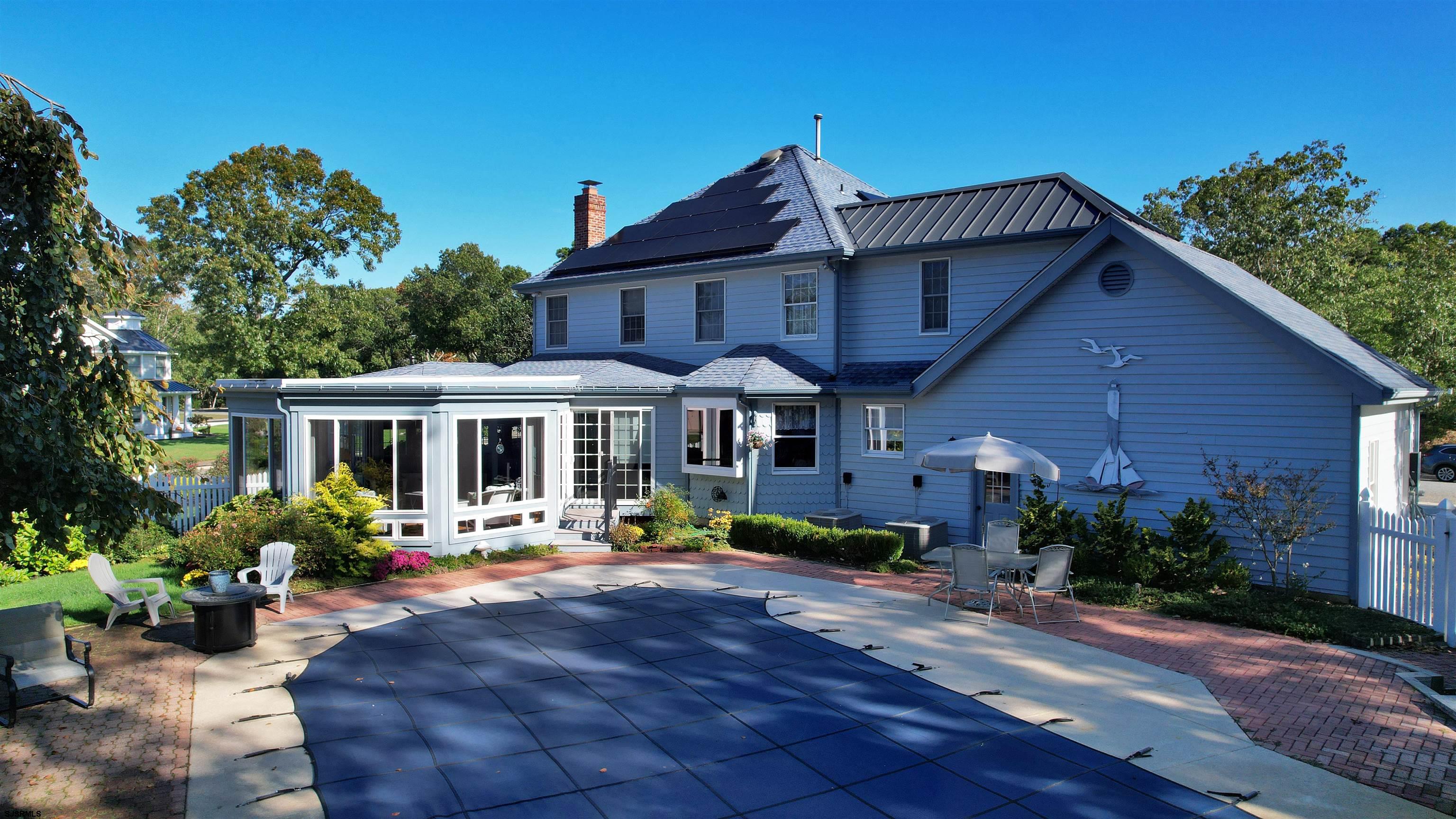 46 Victoria Lane Ocean View, NJ 08230 - Photo 53 of 66 a front view of a house with garden