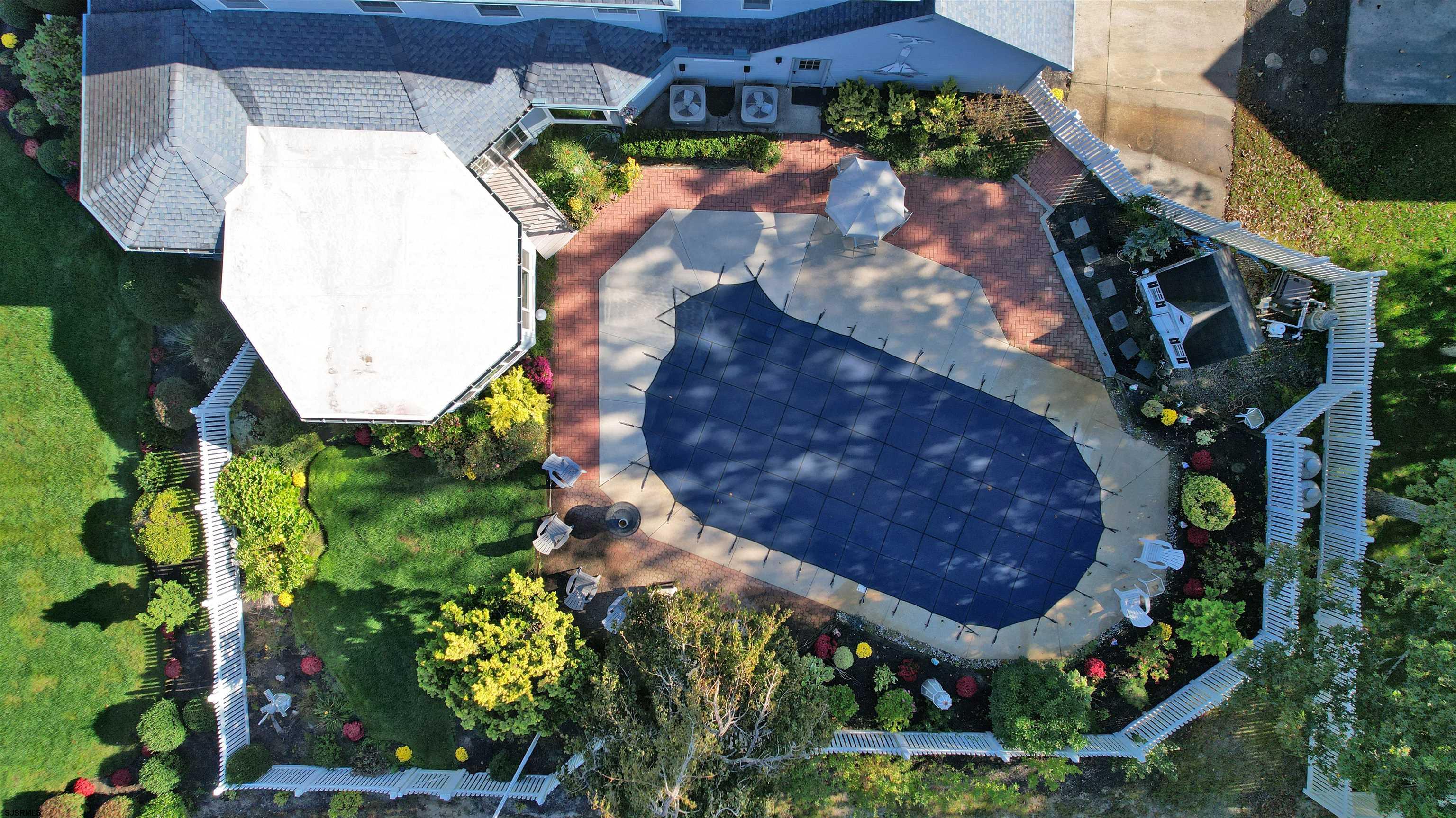 46 Victoria Lane Ocean View, NJ 08230 - Photo 56 of 66 an aerial view of a house with a yard and large trees