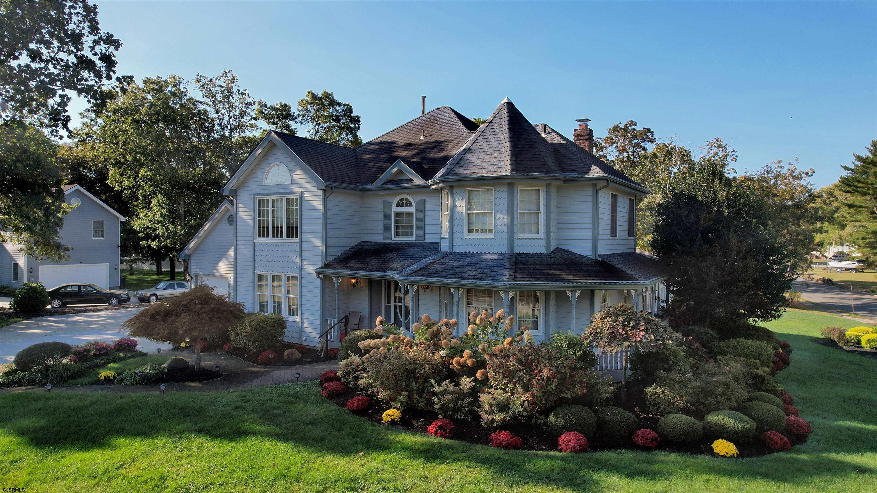 46 Victoria Lane Ocean View, NJ 08230 - Photo 58 of 66 a front view of house with yard and green space