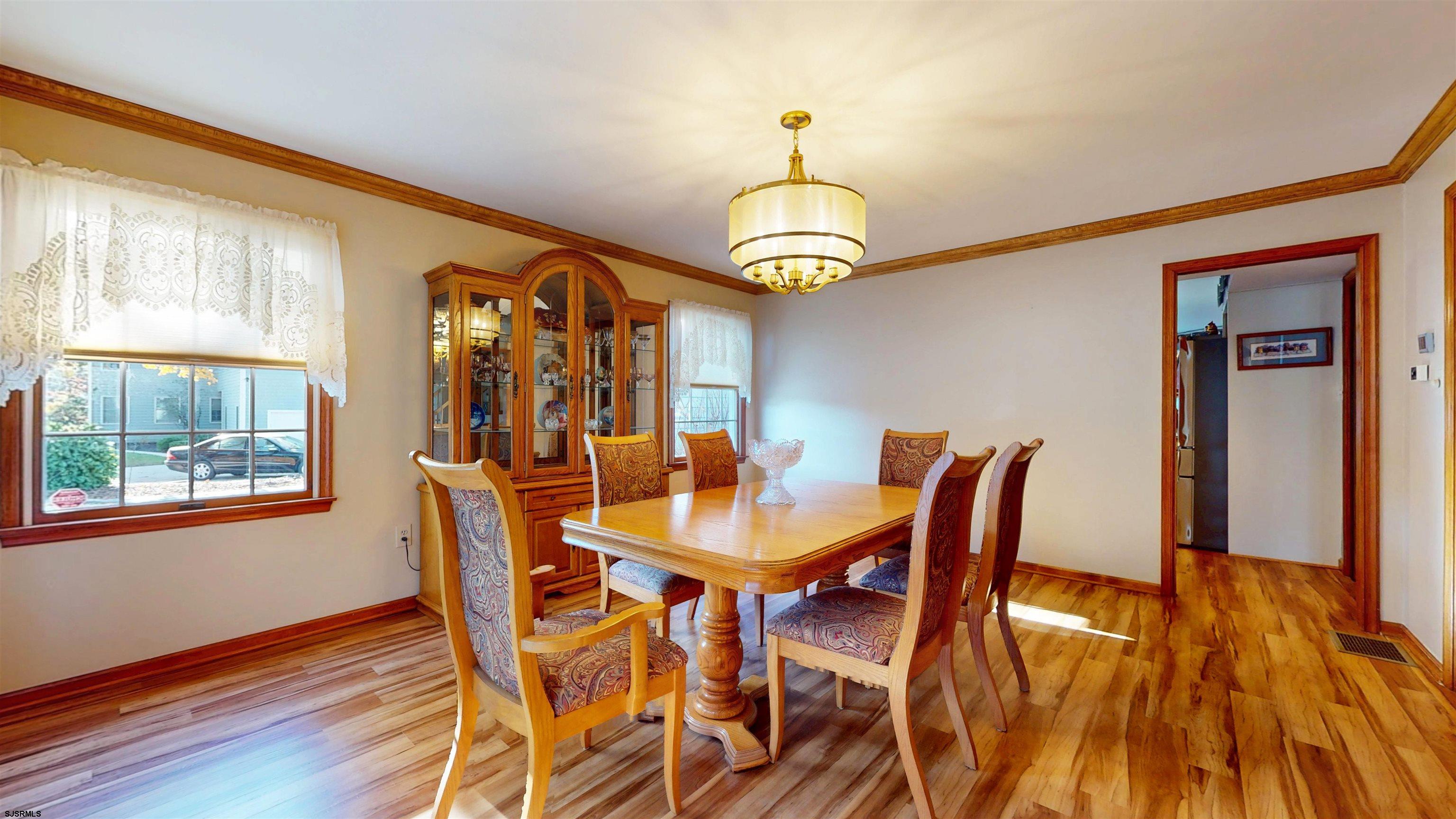 46 Victoria Lane Ocean View, NJ 08230 - Photo 9 of 66 a view of a dining room with furniture window and wooden floor