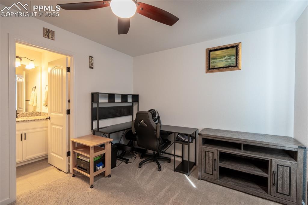 15619 Kitchener Way Monument, CO 80132 - Photo 19 of 40 a view of a workspace with furniture and a window