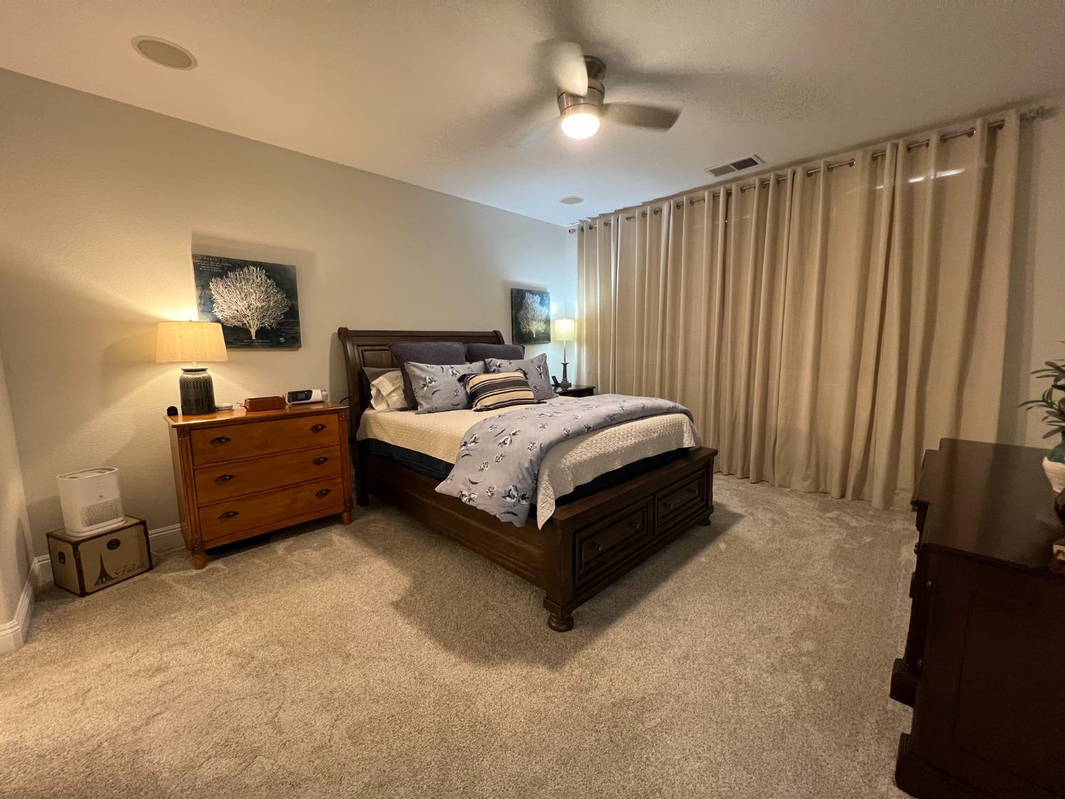 1135 North Perry Avenue Clovis, CA 93611 - Photo 15 of 27 a bed room with a bed and a night stand