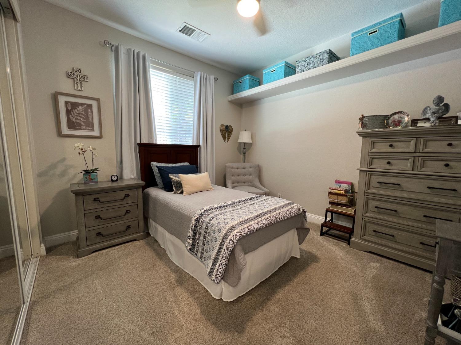 1135 North Perry Avenue Clovis, CA 93611 - Photo 20 of 27 a bedroom with a bed and a dresser