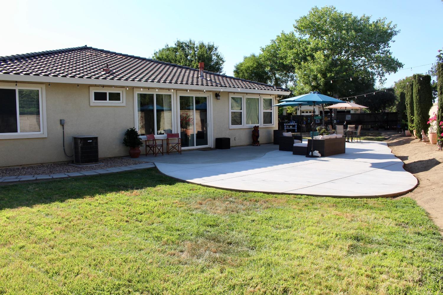 1135 North Perry Avenue Clovis, CA 93611 - Photo 25 of 27 a view of a house with backyard porch and sitting area