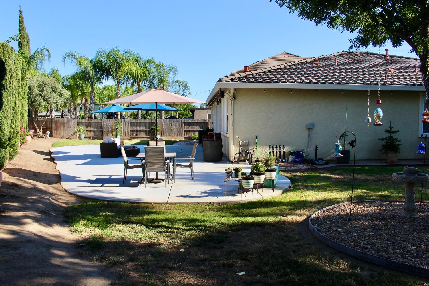 1135 North Perry Avenue Clovis, CA 93611 - Photo 26 of 27 a view of a house with backyard water fountain and sitting area