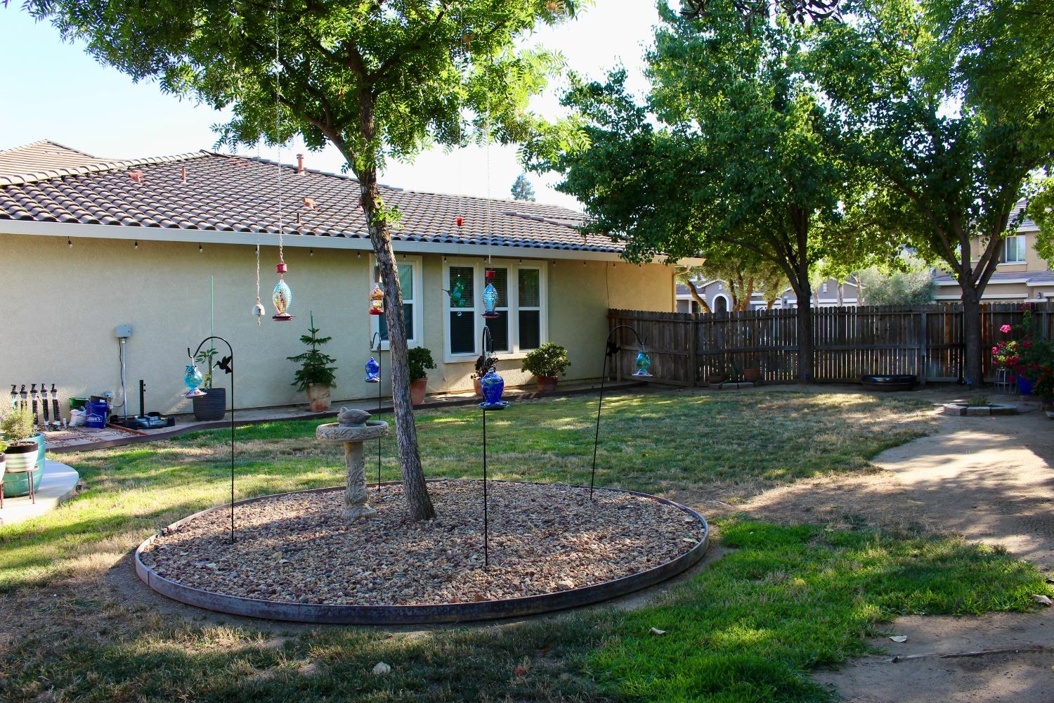 1135 North Perry Avenue Clovis, CA 93611 - Photo 27 of 27 a front view of a house with garden