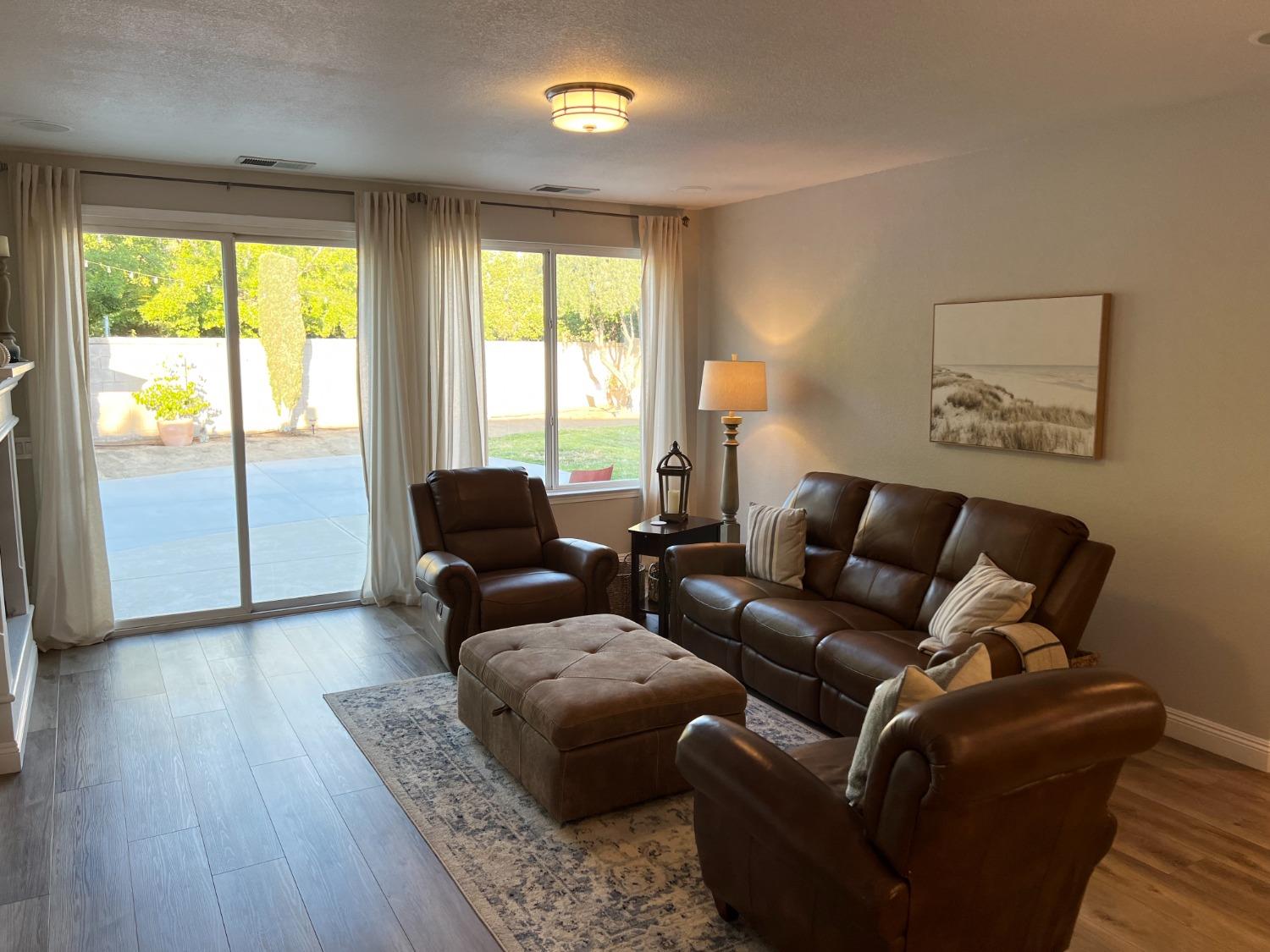 1135 North Perry Avenue Clovis, CA 93611 - Photo 8 of 27 a living room with furniture and a large window
