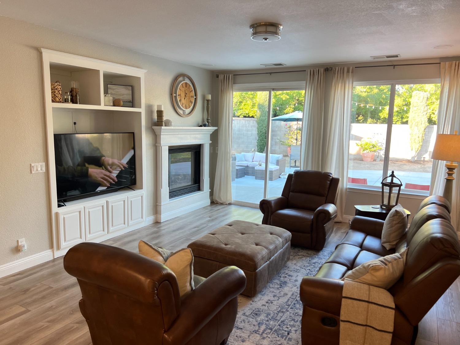 1135 North Perry Avenue Clovis, CA 93611 - Photo 9 of 27 a living room with furniture and a fireplace