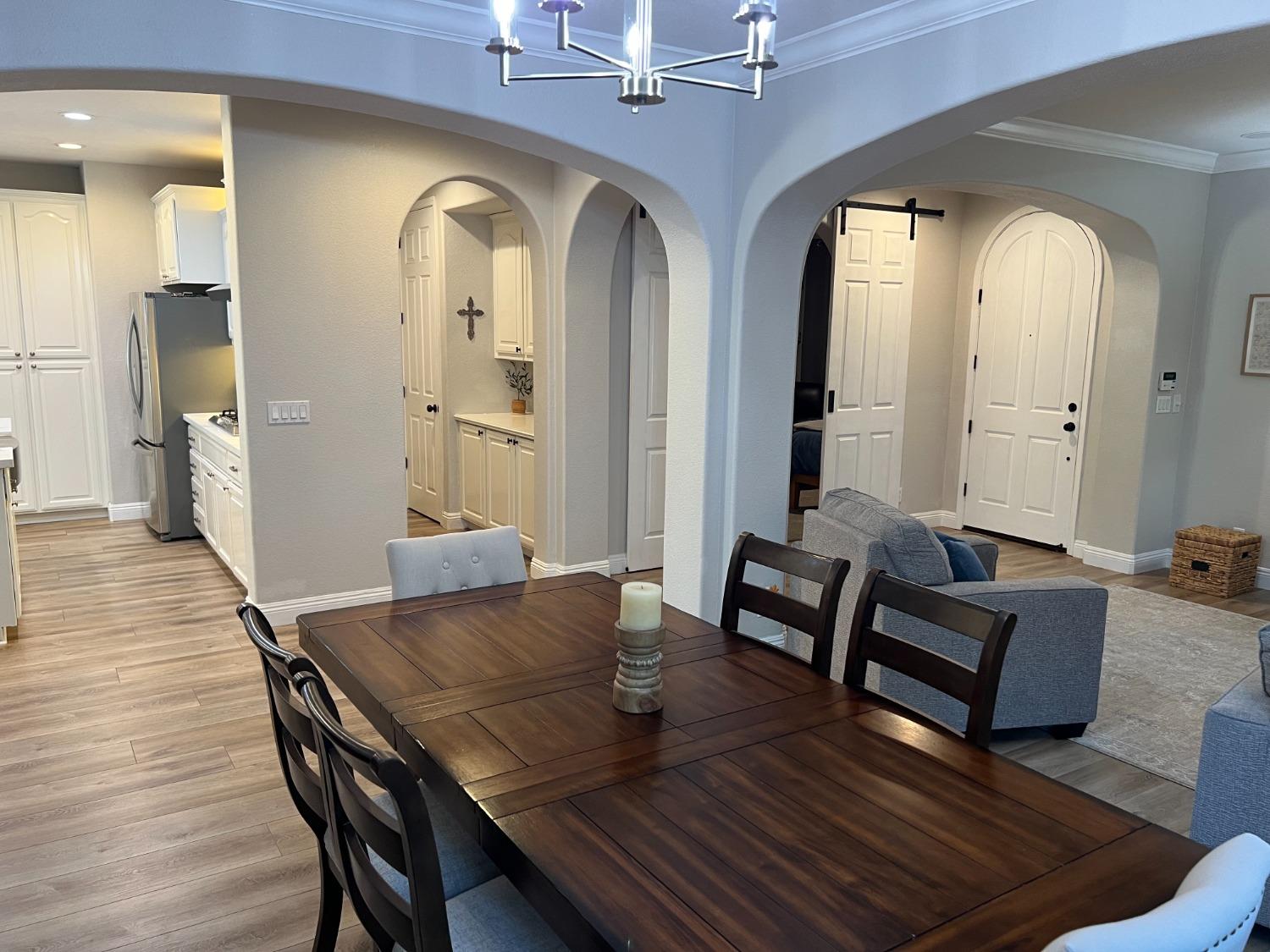 1135 North Perry Avenue Clovis, CA 93611 - Photo 10 of 27 a view of a dining room with furniture and wooden floor