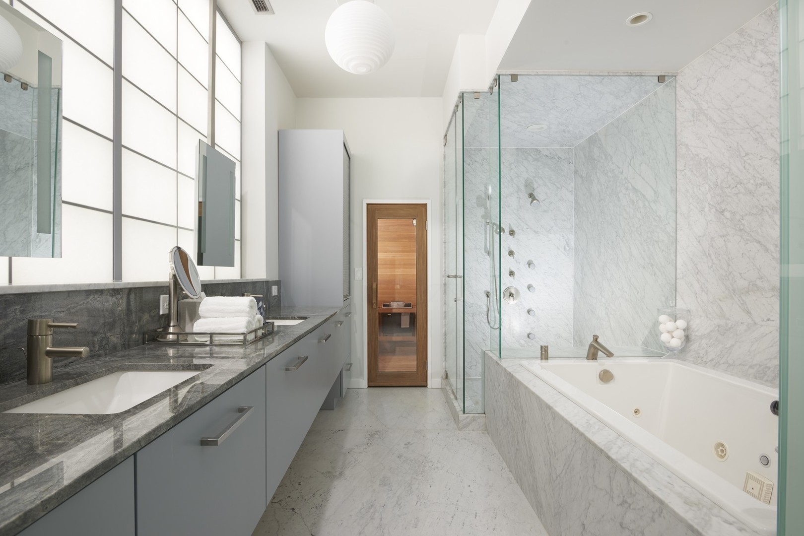 Undisclosed Address Chicago, IL 60622 - Photo 14 of 33 a bathroom with a granite countertop tub sink shower and mirror