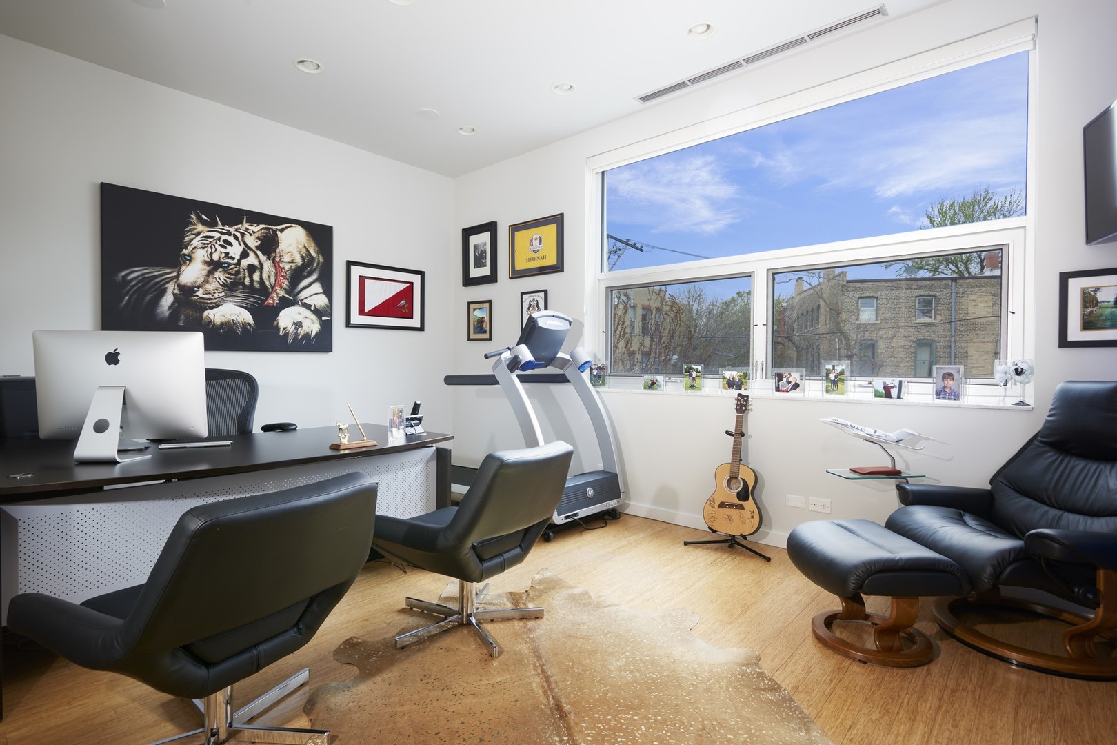 Undisclosed Address Chicago, IL 60622 - Photo 17 of 33 a work room with furniture and a flat screen tv