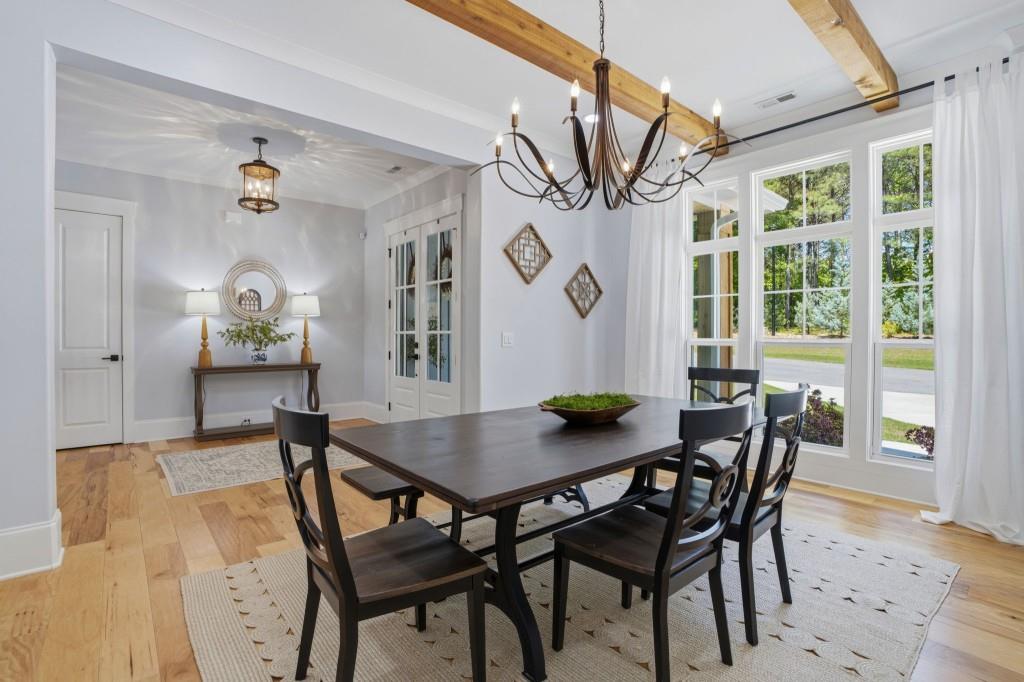 1416 Mt Bethel Road McDonough, GA 30252 - Photo 13 of 67 a view of a dining room with furniture window and wooden floor