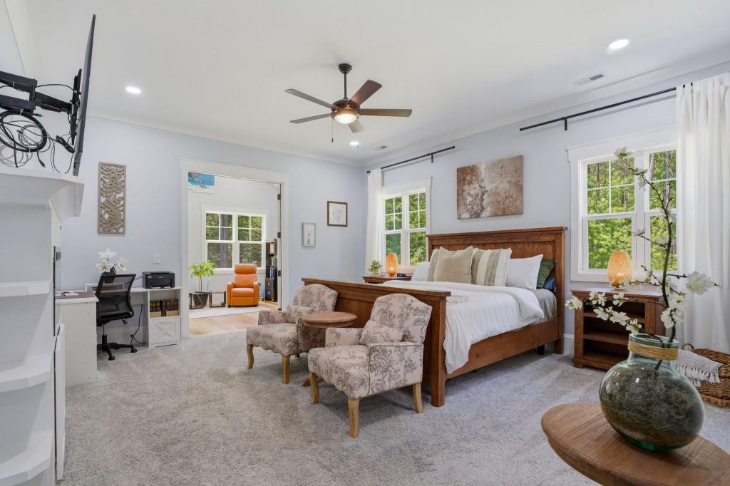 1416 Mt Bethel Road McDonough, GA 30252 - Photo 32 of 67 a spacious bedroom with a bed and a couch