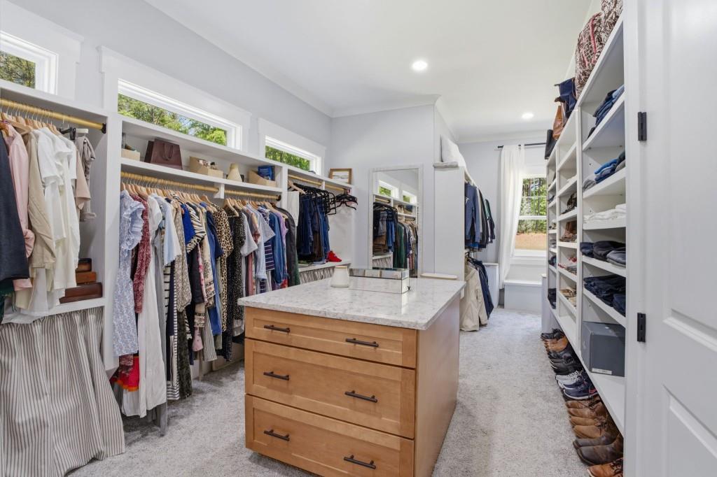 1416 Mt Bethel Road McDonough, GA 30252 - Photo 38 of 67 a view of walk in closet with clothes and shoes