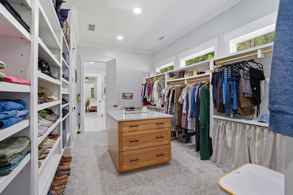 1416 Mt Bethel Road McDonough, GA 30252 - Photo 39 of 67 a view of walk in closet with clothes and shoes