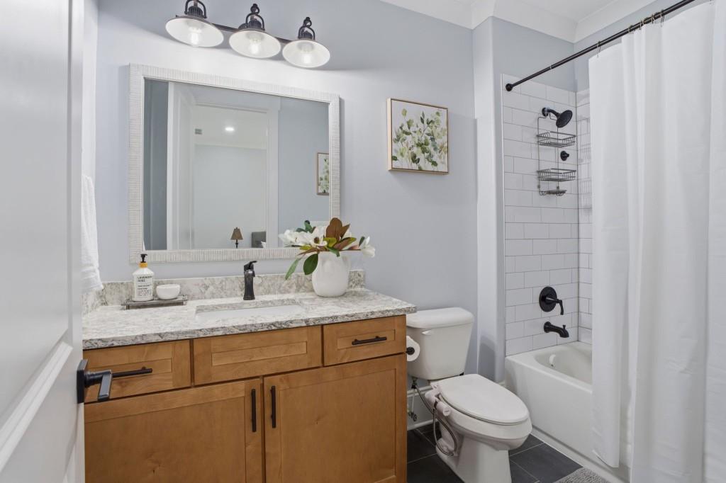 1416 Mt Bethel Road McDonough, GA 30252 - Photo 41 of 67 a bathroom with a granite countertop sink toilet and a mirror