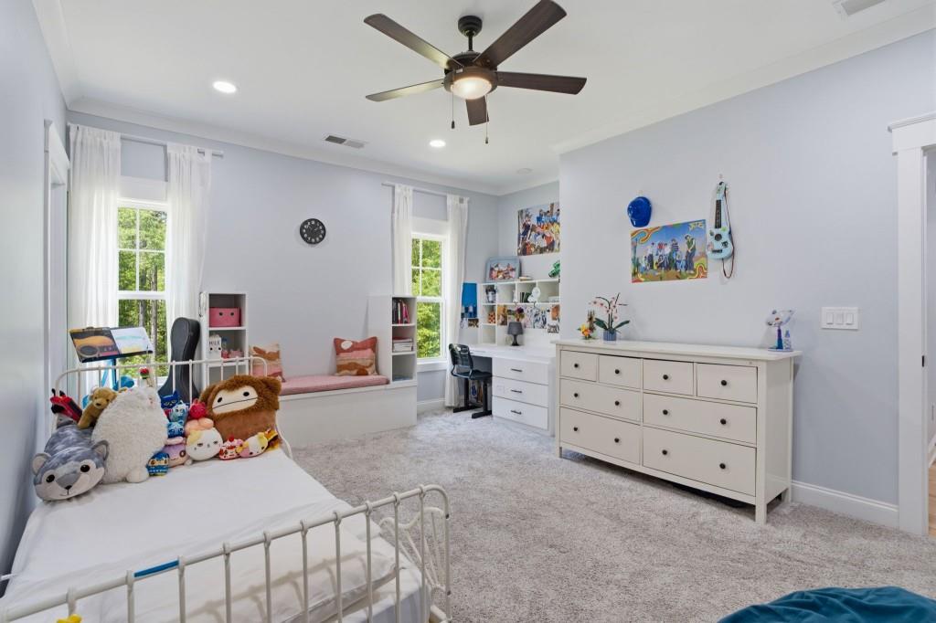1416 Mt Bethel Road McDonough, GA 30252 - Photo 44 of 67 a bedroom with furniture a ceiling fan and a window