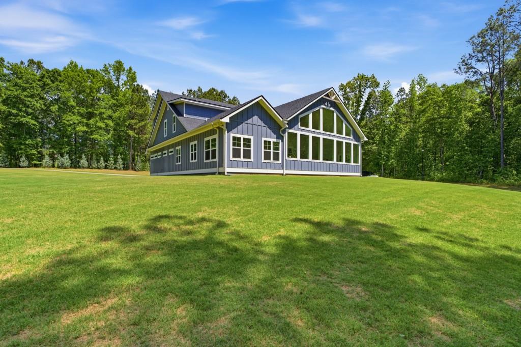1416 Mt Bethel Road McDonough, GA 30252 - Photo 56 of 67 a front view of a house with a garden