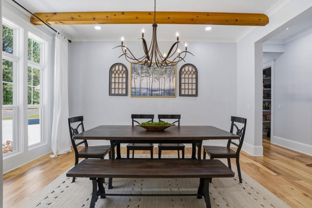 1416 Mt Bethel Road McDonough, GA 30252 - Photo 10 of 67 a view of a dining room with furniture and wooden floor