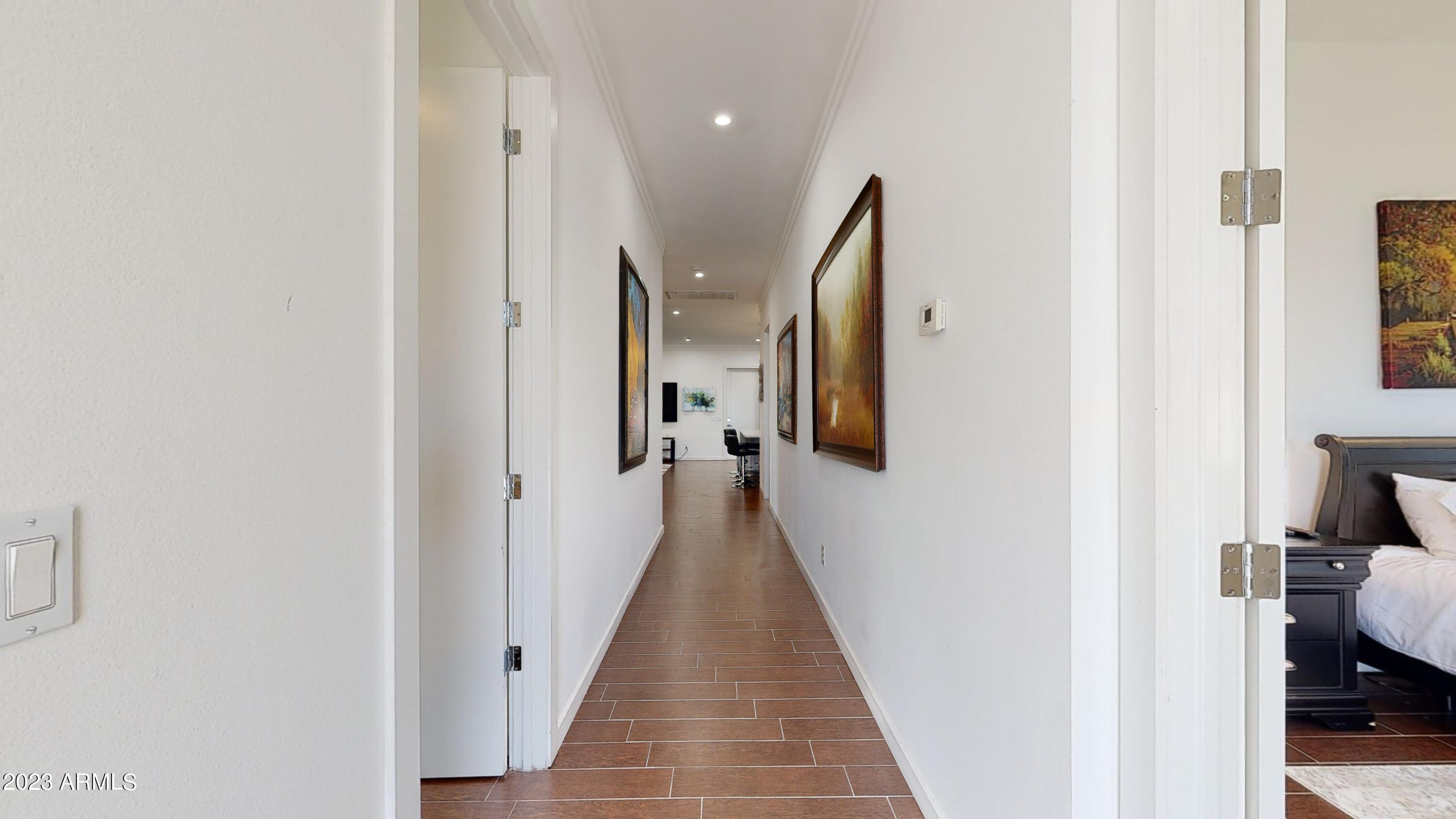 1202 East Colter Street Phoenix, AZ 85014 - Photo 18 of 30 a view of a hallway with wooden floor and staircase