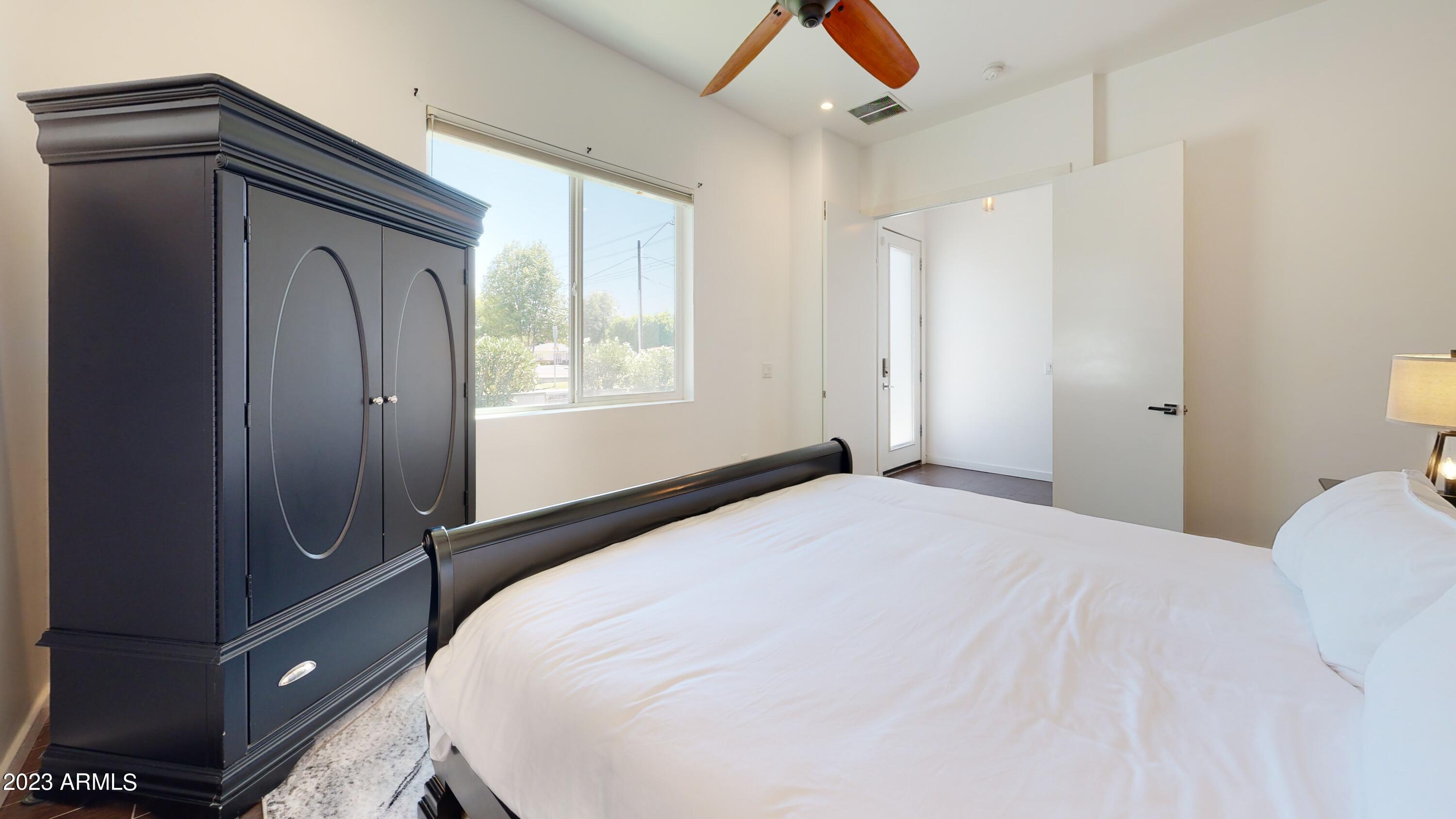 1202 East Colter Street Phoenix, AZ 85014 - Photo 19 of 30 a bedroom with a bed and a window