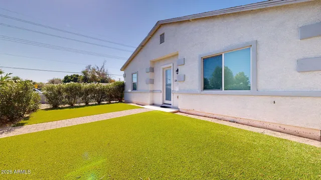 a house with swimming pool in front of it