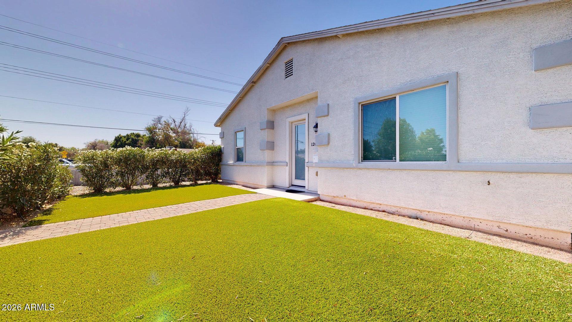 1202 East Colter Street Phoenix, AZ 85014 - Photo 2 of 30 a house with swimming pool in front of it