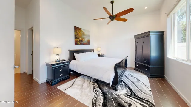 a bed room with a bed and a tv