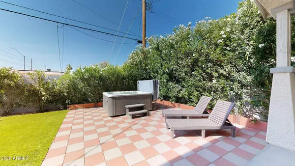 a view of a patio with a dining table and chair