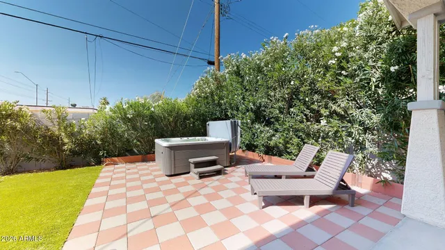 a view of a patio with a dining table and chair