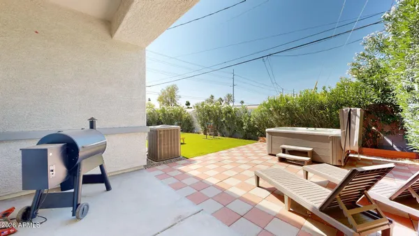 a view of a chairs and table in the patio