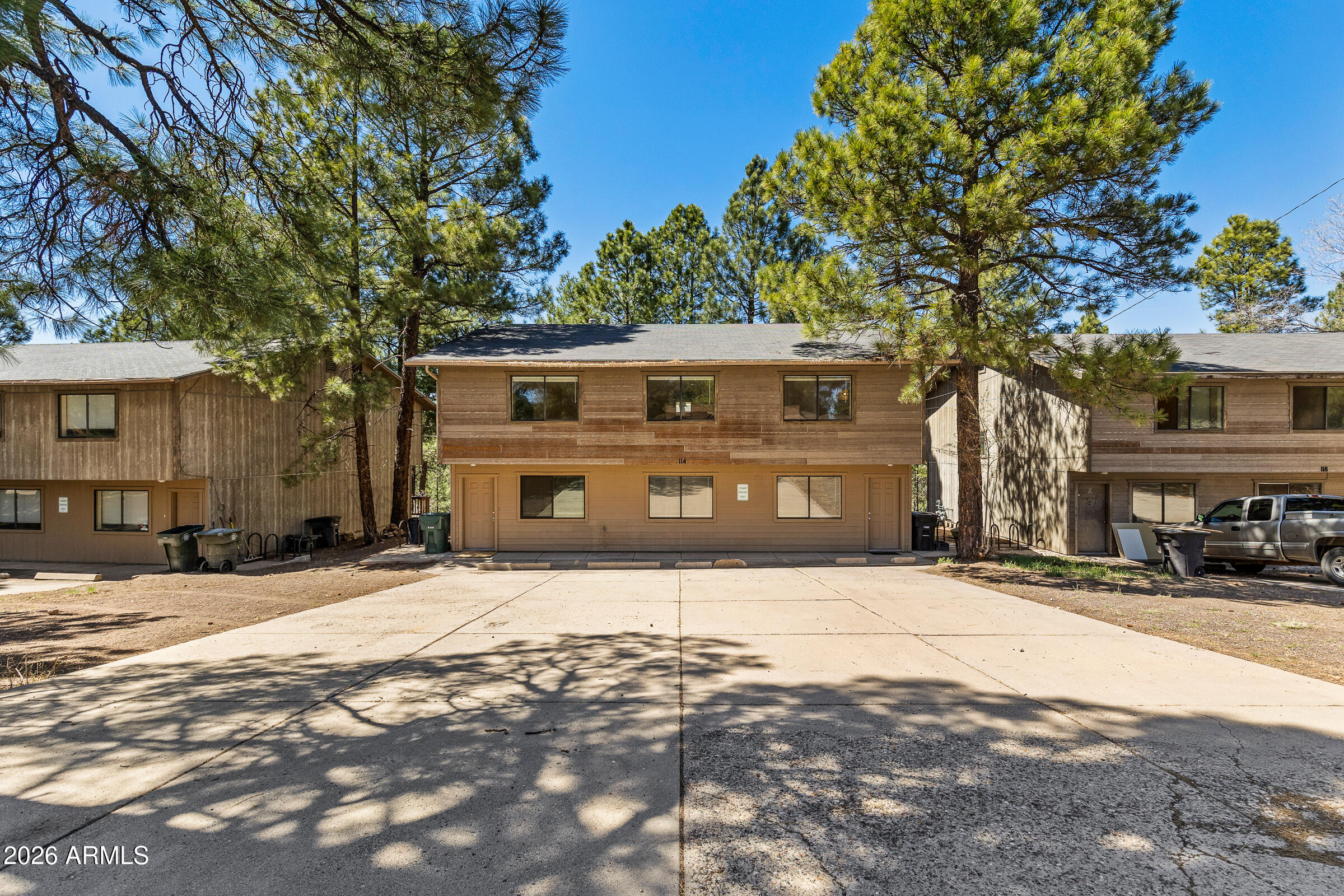 108 East Paseo Del Rio Flagstaff, AZ 86001 - Photo 1 of 25 a front view of a building with a yard